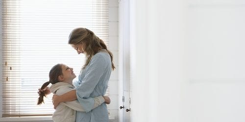 mother hugging child