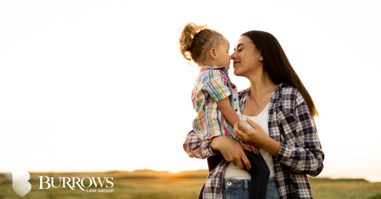 mother holding her daughter