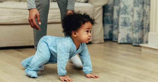 A small child learning to crawl