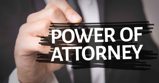 A person writing Power of Attorney