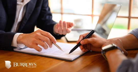 attorney discussing documents with a client