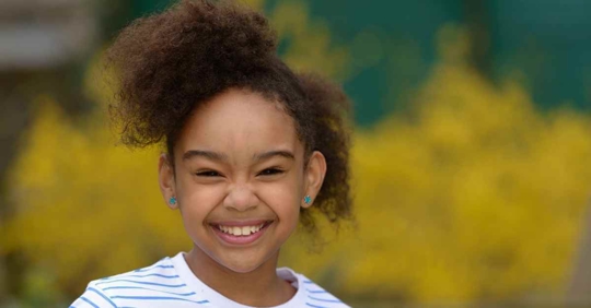 A child smiling at the camera