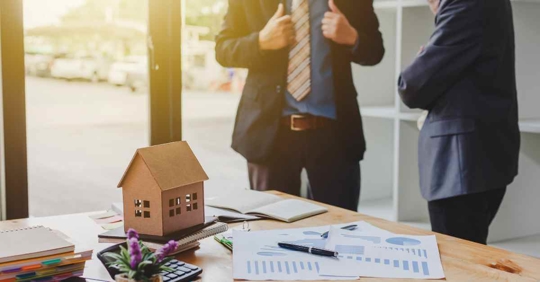 Two men reviewing documents