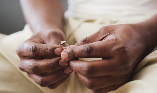 person holding a wedding ring