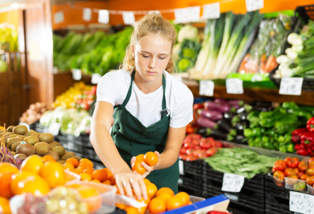 teenager working in a grocery store